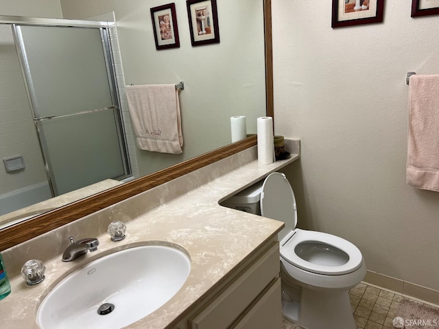 bathroom with tile patterned floors, vanity, toilet, and an enclosed shower