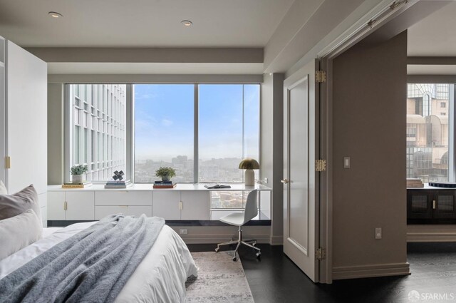 765 Market St Unit 32H, San Francisco, CA 94103 - bedroom with recessed lighting, a view of city, baseboards, and dark wood-style floors
