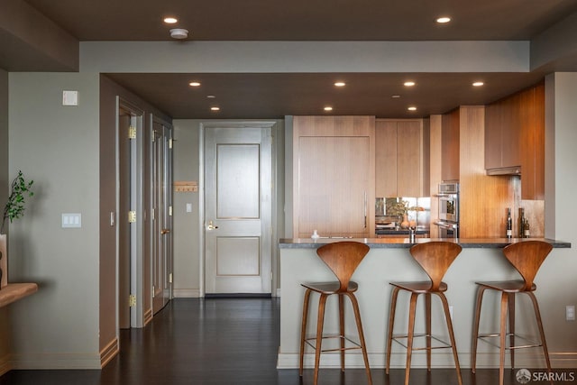 765 Market St Unit 32H, San Francisco, CA 94103 - kitchen featuring baseboards, stone countertops, double oven, and recessed lighting