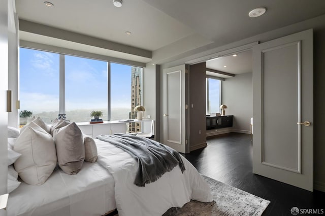 765 Market St Unit 32H, San Francisco, CA 94103 - bedroom featuring dark wood-style flooring, baseboards, recessed lighting, and multiple windows