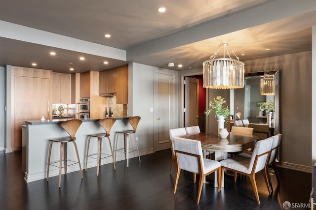 765 Market St Unit 32H, San Francisco, CA 94103 - dining room with an inviting chandelier, baseboards, recessed lighting, and dark wood-style floors