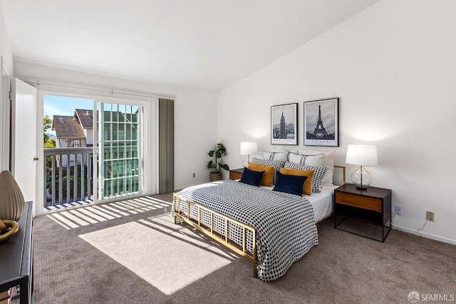 carpeted bedroom featuring access to exterior and lofted ceiling