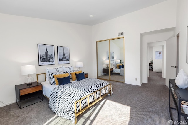 carpeted bedroom featuring a closet