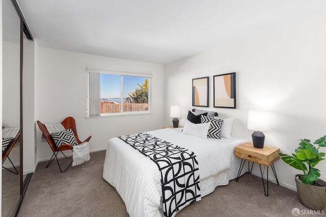 bedroom with carpet and a closet