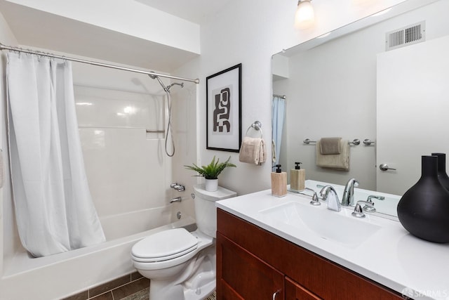 full bathroom with tile patterned flooring, vanity, shower / tub combo, and toilet