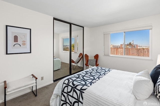 carpeted bedroom featuring a closet