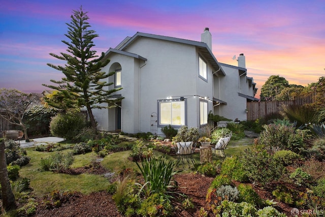 view of property exterior at dusk