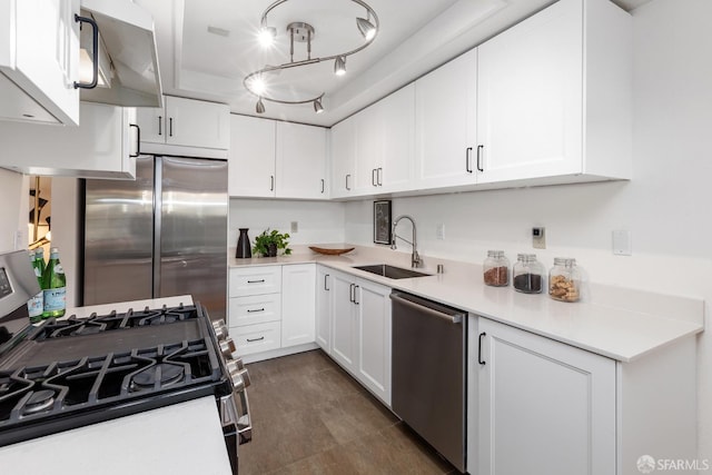 kitchen with white cabinetry, sink, and appliances with stainless steel finishes