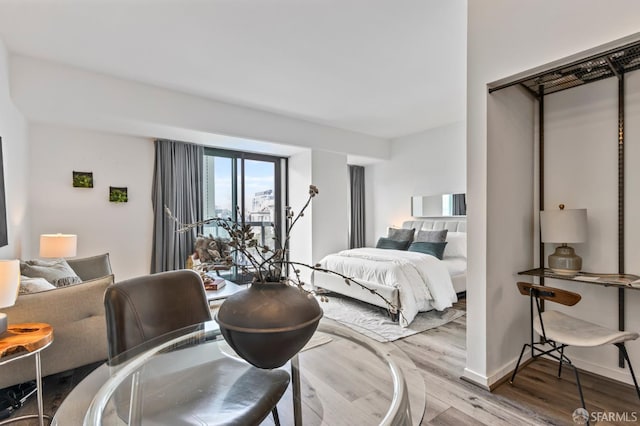 1 Daniel Burnham Ct Unit 219, San Francisco, CA 94109 - bedroom with wood finished floors and baseboards