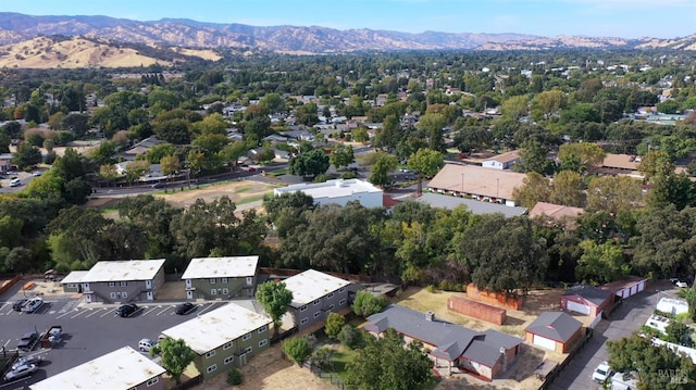 birds eye view of property featuring a mountain view