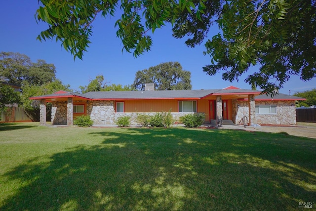 ranch-style house with a front lawn