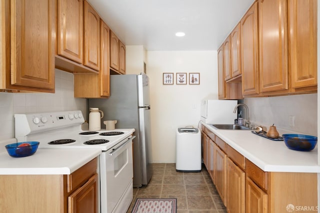 kitchen featuring white electric range, backsplash, and sink