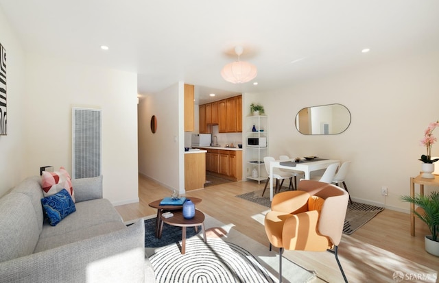 living room with light hardwood / wood-style floors