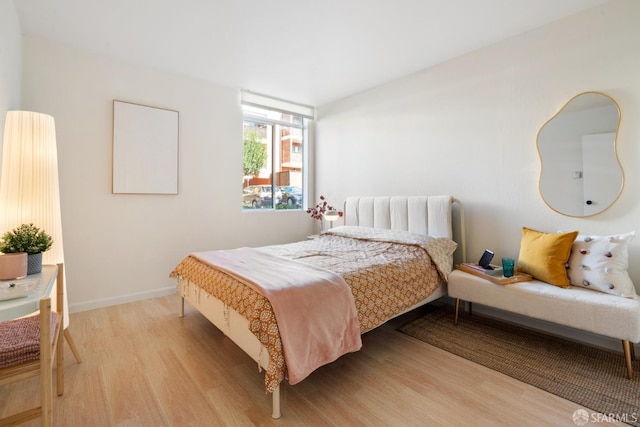 bedroom with light hardwood / wood-style floors