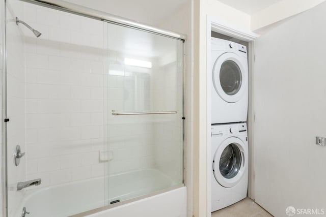 washroom featuring stacked washing maching and dryer