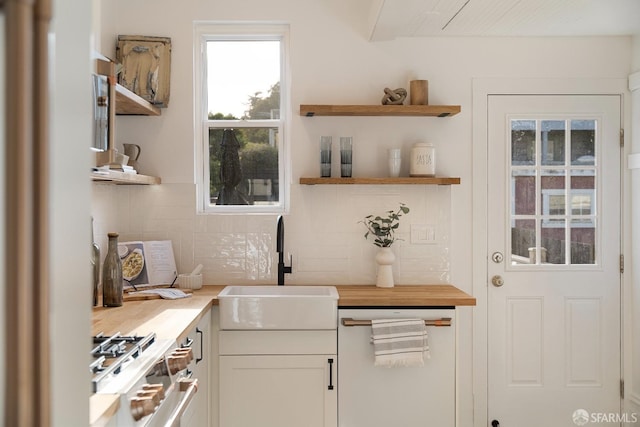 137 Edna St, San Francisco, CA 94112 - kitchen with double oven range, open shelves, a sink, decorative backsplash, and white cabinetry