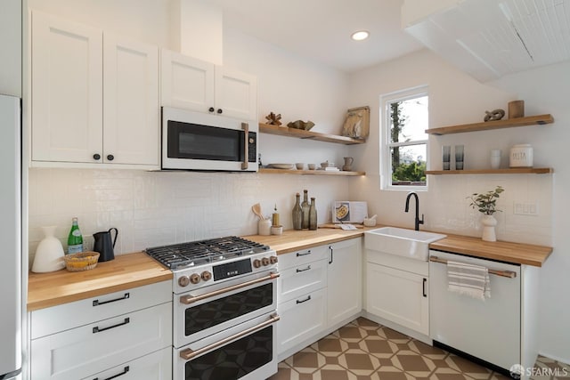 137 Edna St, San Francisco, CA 94112 - kitchen featuring white appliances, butcher block countertops, a sink, open shelves, and recessed lighting