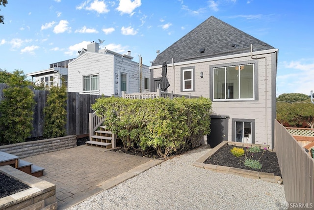 137 Edna St, San Francisco, CA 94112 - rear view of property with a patio area and roof with shingles