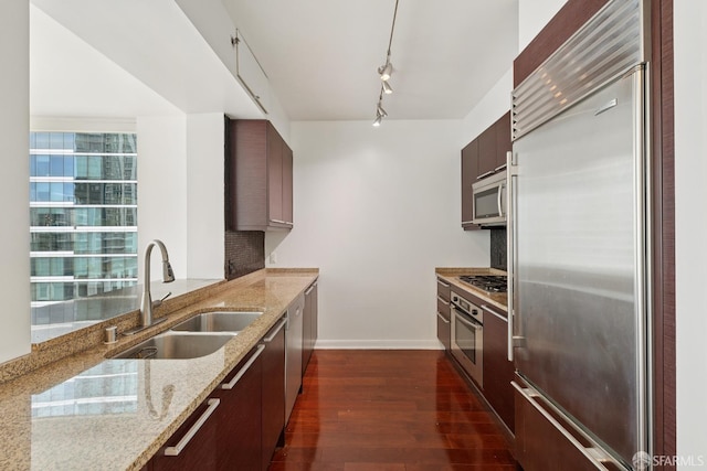 425 1st St Unit 1307, San Francisco, CA 94105 - kitchen featuring appliances with stainless steel finishes, a sink, dark wood finished floors, baseboards, and modern cabinets