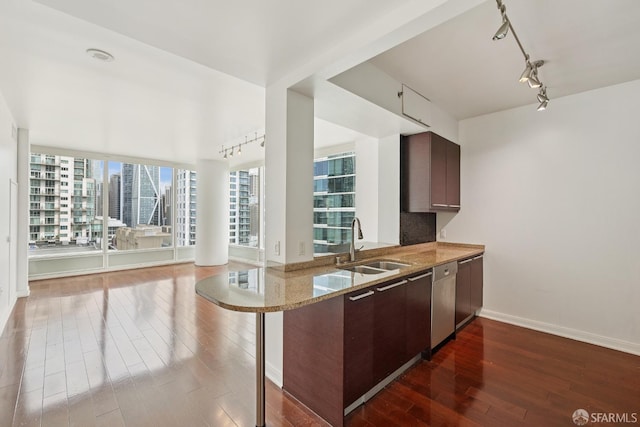 425 1st St Unit 1307, San Francisco, CA 94105 - kitchen with rail lighting, a sink, dark wood-type flooring, light stone counters, and stainless steel dishwasher