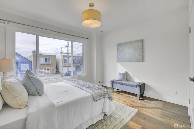 bedroom with hardwood / wood-style flooring