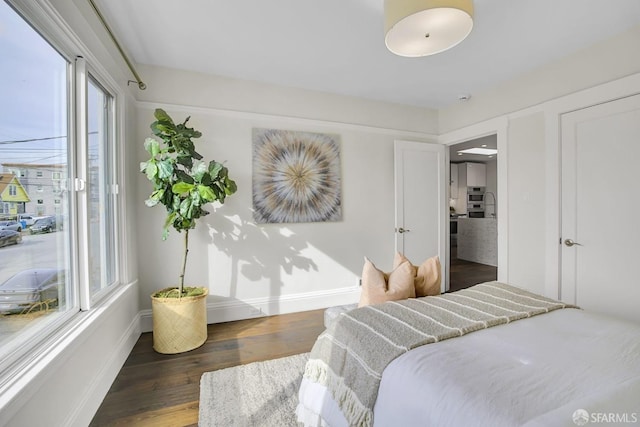 bedroom featuring dark hardwood / wood-style flooring