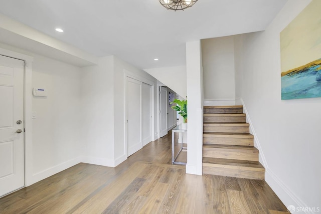 stairs with wood-type flooring