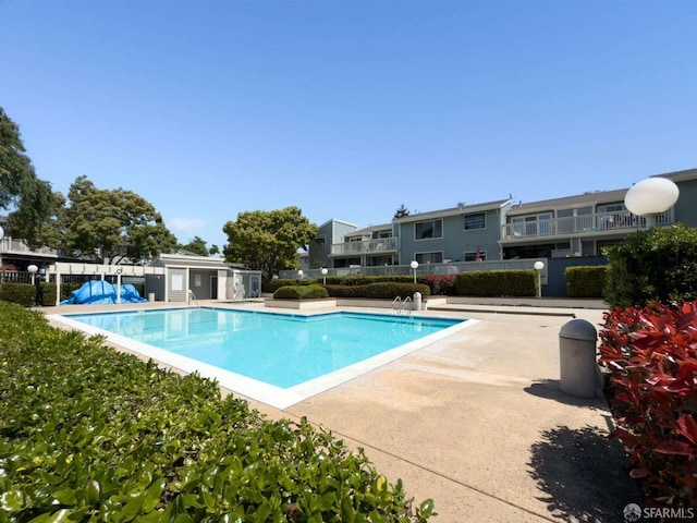 3685 Nutwood Ter Unit 313, Fremont, CA 94536 - community pool featuring fence, a patio area, and a residential view
