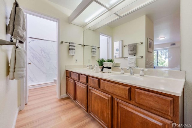 3685 Nutwood Ter Unit 313, Fremont, CA 94536 - full bath with wood finished floors, toilet, double vanity, and a shower