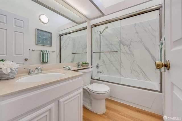 3685 Nutwood Ter Unit 313, Fremont, CA 94536 - full bath featuring vanity, toilet, enclosed tub / shower combo, and wood finished floors