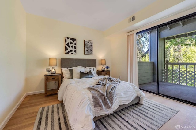 3685 Nutwood Ter Unit 313, Fremont, CA 94536 - bedroom with access to exterior, light wood-style flooring, and baseboards