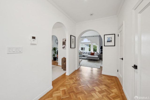 corridor with light parquet flooring and ornamental molding