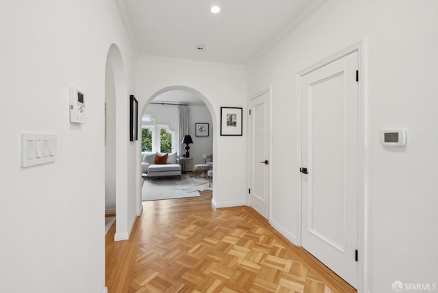 hall featuring crown molding and light parquet flooring