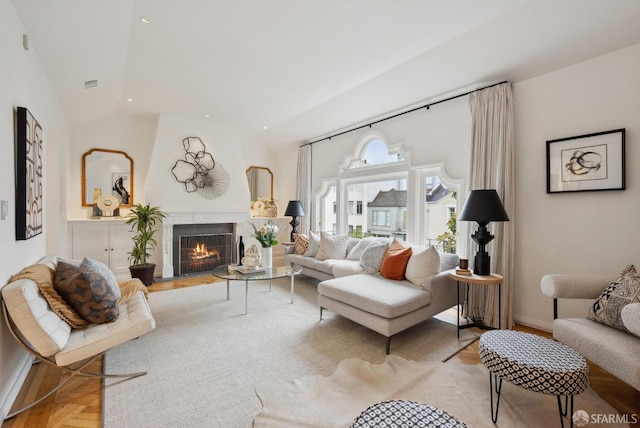 living room featuring lofted ceiling