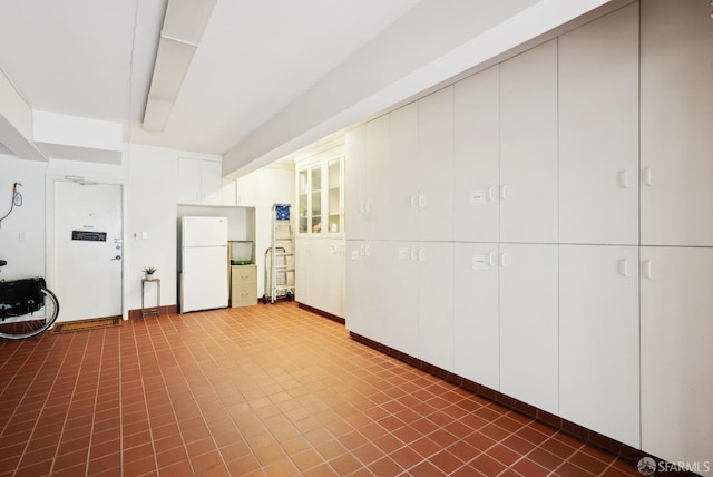 basement with white refrigerator