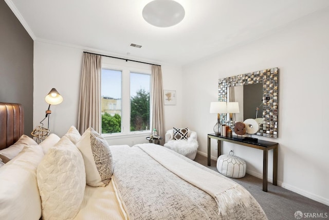 bedroom with ornamental molding and carpet