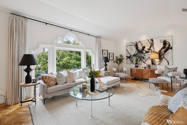 living room featuring lofted ceiling and light parquet flooring