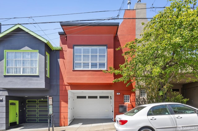 8 Milton St, San Francisco, CA 94112 - view of front facade with a garage, stucco siding, concrete driveway, and a chimney