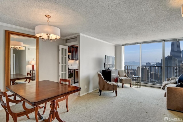 carpeted dining room with crown molding, expansive windows, a baseboard heating unit, a textured ceiling, and an inviting chandelier