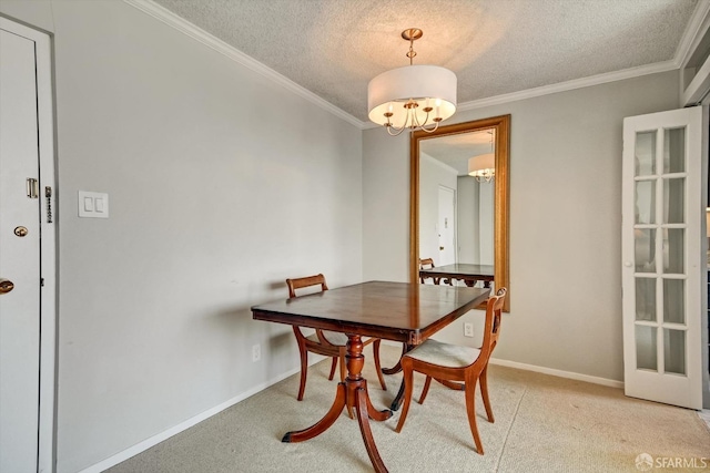 dining room with a textured ceiling, crown molding, and a chandelier