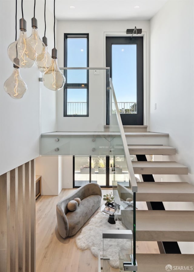 stairway featuring hardwood / wood-style floors