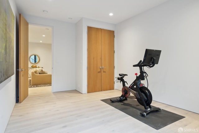 exercise area featuring light wood-type flooring