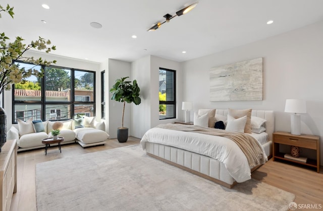 bedroom with light wood-type flooring