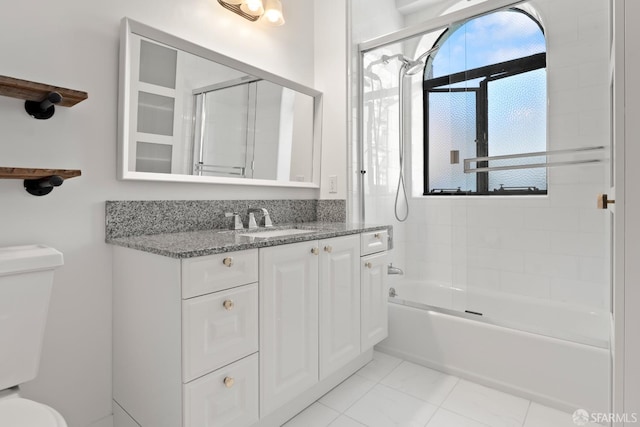 full bathroom with vanity, enclosed tub / shower combo, and toilet