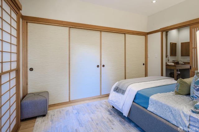 bedroom featuring a closet and hardwood / wood-style floors