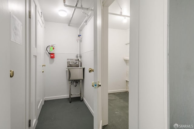 bathroom with concrete floors and sink