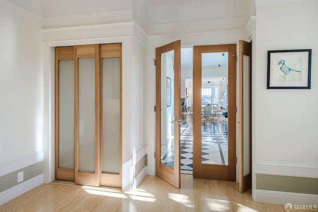 doorway featuring french doors and light hardwood / wood-style flooring