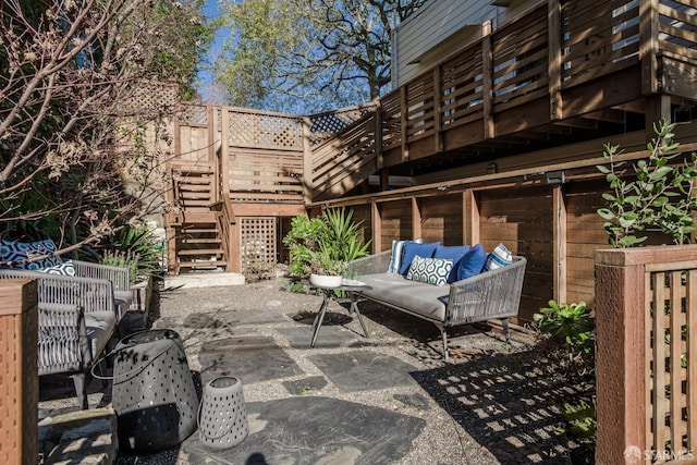 view of patio / terrace featuring a wooden deck and an outdoor living space