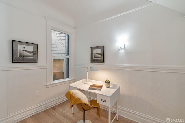 home office with wood finished floors