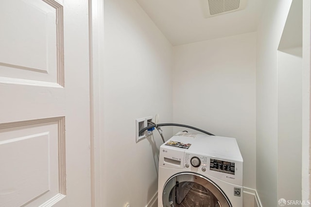 washroom with washer / clothes dryer and visible vents